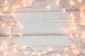 Christmas lights wooden background