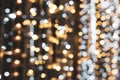 Christmas lights. Xmas. Festive New Year blurred golden, silver and black background. Sparkling backdrop, texture. Bokeh Royalty Free Stock Photo