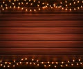 Christmas lights. Garlands on wooden background Royalty Free Stock Photo