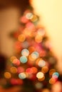 Christmas lights on xmas tree defocused. Holiday bokeh background Royalty Free Stock Photo
