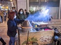 Christmas in Lisbon with street vendor selling roasted chestnuts during covid pandemec