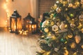 Christmas living room with a Christmas tree and gifts, candles, lanterns. Beautiful New Year decorated classic home interior. Wint Royalty Free Stock Photo