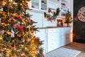 Christmas living room with a Christmas tree, gifts and clock. Beautiful New Year decorated classic home interior. Winter backgroun Royalty Free Stock Photo