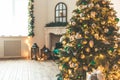 Christmas living room with a fireplace, sofa, Christmas tree and gifts. Beautiful New Year decorated classic home interior. Winter Royalty Free Stock Photo