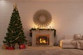 Christmas living room with fireplace, tree and presents