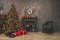 Christmas living room interior design with xmas tree decorated garland and ball, presents, gifts, fireplace and candles Royalty Free Stock Photo