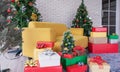 Christmas living room, Yellow sofa with Christmas trees, gift boxes, and Christmas decorations Royalty Free Stock Photo