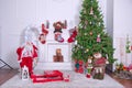 Christmas loft style interior. Soft toy bear on background of Christmas tree .Decorated Christmas room with beautiful tree . New Royalty Free Stock Photo