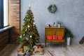 Christmas loft style living room interior. Christmas tree with gifts