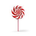 Christmas lollipop isolated on white background. New year candy icon with spiral red and white stripes and swirls. Round Royalty Free Stock Photo
