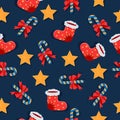 Christmas lollipops, cookies, socks seamless pattern on dark background.