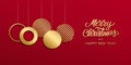 Christmas luxury holiday banner with gold handwritten Merry Christmas greetings and gold colored christmas balls.