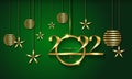 2022 Christmas luxury holiday banner with gold handwritten Merry Christmas and Happy New Year, gold colored Christmas balls Royalty Free Stock Photo