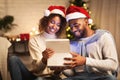 Christmas magic. Afro couple opening gift box