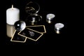 Christmas magical sessions with tarot cards, candle, ring and mirror isolated on black background. Mysterious Christmastide Royalty Free Stock Photo