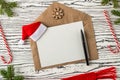 Christmas mail, envelopes with letters on a light wooden table