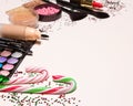 Christmas makeup cosmetics with candy canes and confetti Royalty Free Stock Photo