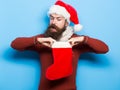 Christmas man with decorative stocking Royalty Free Stock Photo