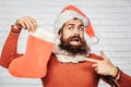 Christmas man with decorative stocking Royalty Free Stock Photo