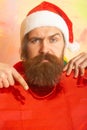 Christmas man with shopping bag. Closeup face of bearded man celebrate Christmas.