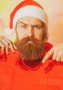 Christmas man with shopping bag. Closeup face of bearded man celebrate Christmas.