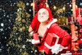 Christmas man in snow. Santa Claus thief with a bag of christmas gifts. Home Burglar Santa Claus in a Mask Into the