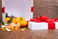 Christmas mandarin orange pouring out of holiday box
