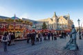 Christmas market, Dusseldorf, Germany with carrousel, street artist, Christmas stalls and Town Hall in background.