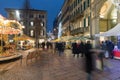 Christmas market in the evening and crowd of people. Varese, Italy Royalty Free Stock Photo