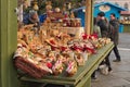 Christmas market with kiosks and stalls, people bying gifts