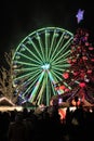 Luxembourg - 2022 Winterlights - A huge carousel wheel with Christmas tree at the crowded Christmas Market at night