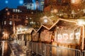 Christmas market spirit during snow night. Royalty Free Stock Photo