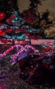 Panoramic picture of Christmas lights all around the bridge, trees, signs, posts houses and lights at night Royalty Free Stock Photo
