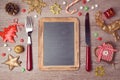 Christmas menu background with chalkboard and decorations. View from above Royalty Free Stock Photo