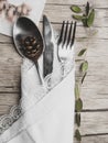 Christmas menu concept . Flat lay with Xmas decorations and cone, silver fork knife spoon set with napkin. Copy space Royalty Free Stock Photo