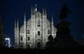 Christmas in Milan, Italy. The Duomo cathedral facade and a giant Christmas tree at night Royalty Free Stock Photo