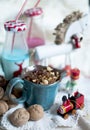 Christmas milk in bottles and holiday sweets. New Year party. Colored milk and straws
