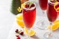 Christmas mimosas with cranberry juice and champagne or sparkling wine, festive Christmas cocktails