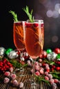 Christmas Mimosas Garnished with Sugared Cranberries and Rosemary Royalty Free Stock Photo