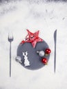 Christmas minimal table setting decoration. Cookies, stars and balls. Flour imprint of fork, plate and knife. Christmas aesthetics