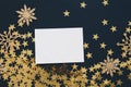 Christmas mock up greeteng card on black background with glitter snowflakes ornaments gold stars confetti. Invitation, paper. Plac