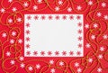 Christmas mockup with snowflakes and gold garland on red background. Happy new year. Space for text. Winter concept Royalty Free Stock Photo