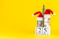 Christmas money gift on yellow pastel trendy background Royalty Free Stock Photo