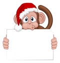 Christmas Monkey Cartoon Character in Santa Hat Royalty Free Stock Photo