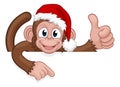 Christmas Monkey Cartoon Character in Santa Hat Royalty Free Stock Photo