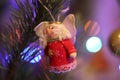 Christmas New Year tree red doll with christmas lights Royalty Free Stock Photo