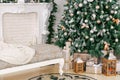 Christmas morning. classic luxury apartments with a white fireplace, decorated christmas tree. Holiday card. Royalty Free Stock Photo