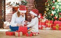 Christmas morning. family mother and daughter unpack, open gift Royalty Free Stock Photo