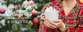 Christmas morning, girl in pajamas with a cup of hot cocoa with marshmallows. Selective focus Royalty Free Stock Photo