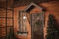 Christmas morning. porch a small house with a decorated door with a Christmas wreath. Winter fairy tale Royalty Free Stock Photo